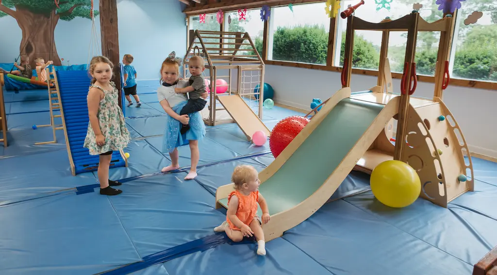 Children in open play soft-play area